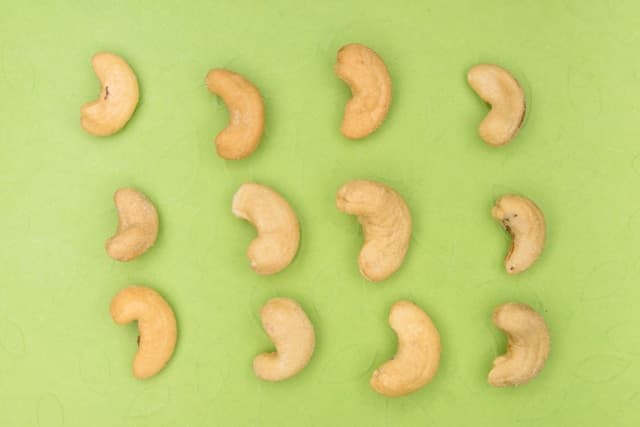 Cashew on green background