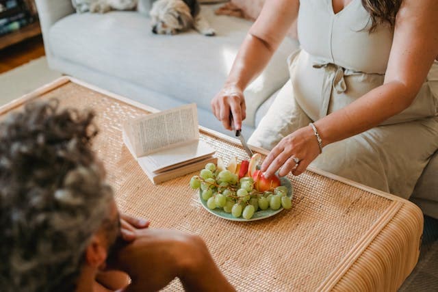woman cutting fruits